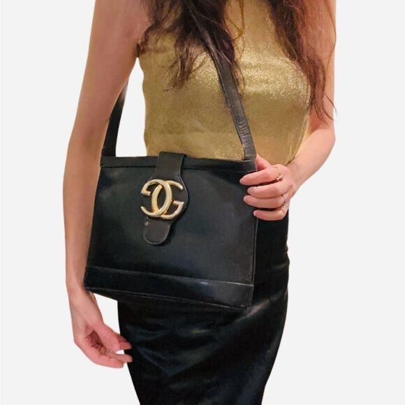 Gucci Handbags - Gucci Black and Gold Leather Shoulder Bag with Iconic Logo